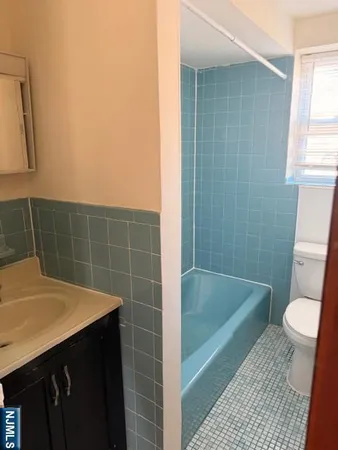 a bathroom with a sink and a toilet