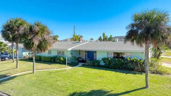 a view of a house with swimming pool and a porch