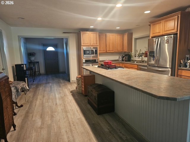 84949 Highway 101 Seaside, OR 97138 - Photo 2 of 5 a kitchen with a sink a counter top space stainless steel appliances and a large window