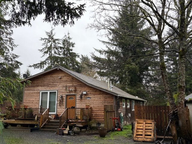 84949 Highway 101 Seaside, OR 97138 - Photo 4 of 5 a view of a house with a yard