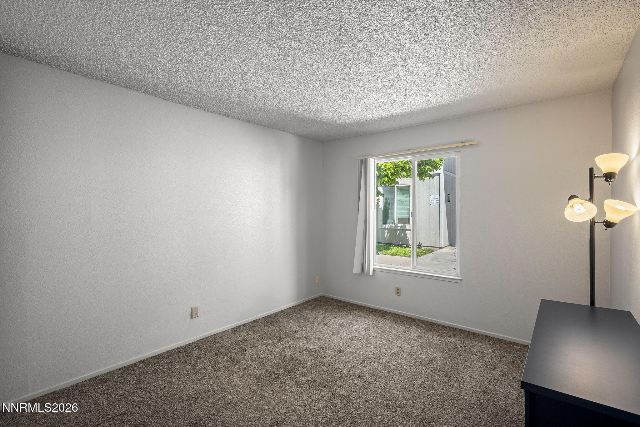 400 South Saliman Road, Unit 129 Carson City, NV 89701 - Photo 9 of 15 an empty room with windows
