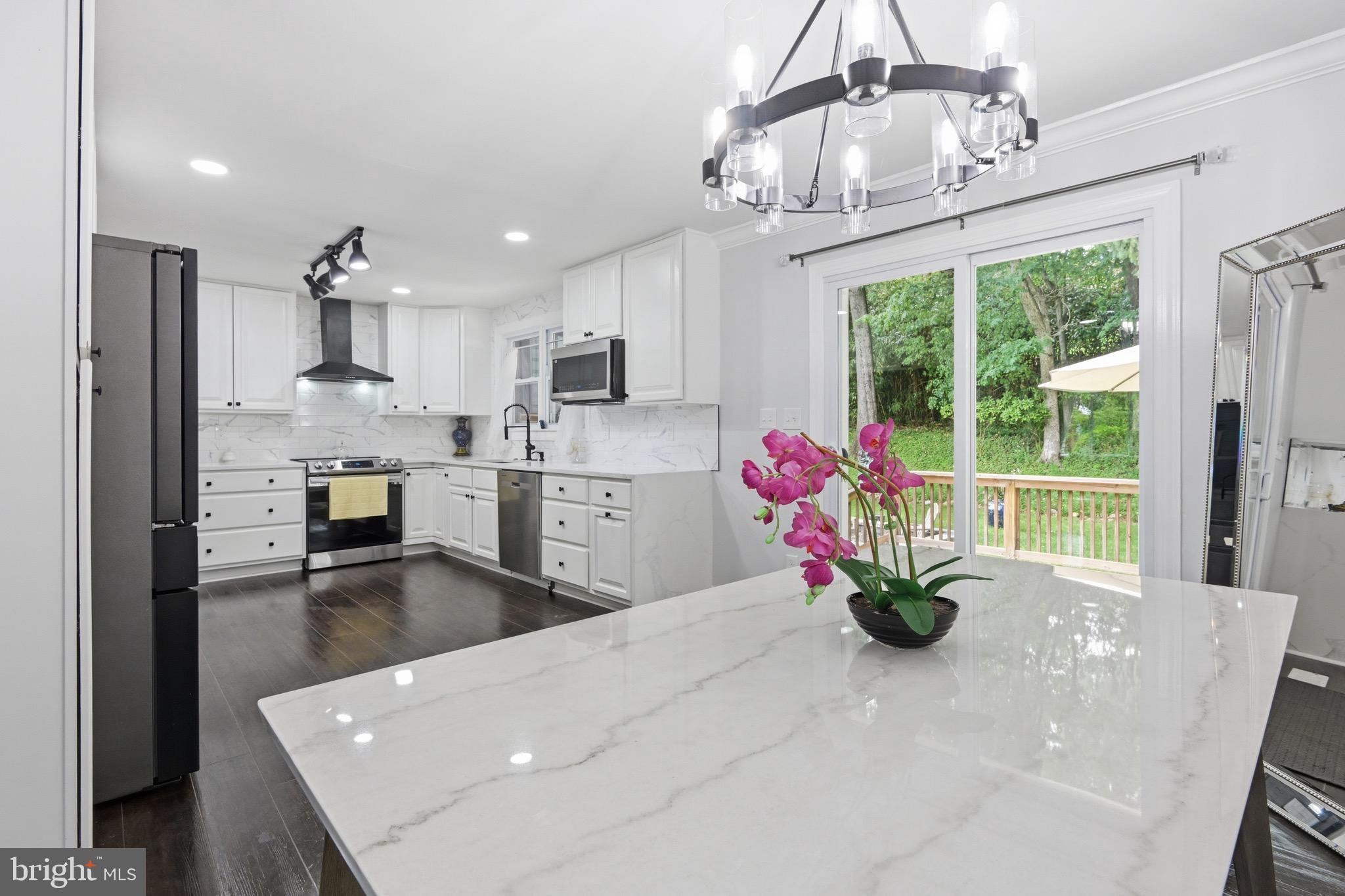 238 East Timonium Road Lutherville-Timonium, MD 21093 - Photo 14 of 40 a living room with stainless steel appliances furniture a chandelier open kitchen view