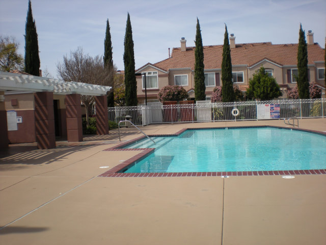 20 Torregata Loop San Jose, CA 95134 - Photo 12 of 12 a house view with a sitting space and garden space