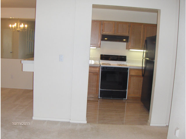 20 Torregata Loop San Jose, CA 95134 - Photo 5 of 12 a kitchen with a sink and a refrigerator