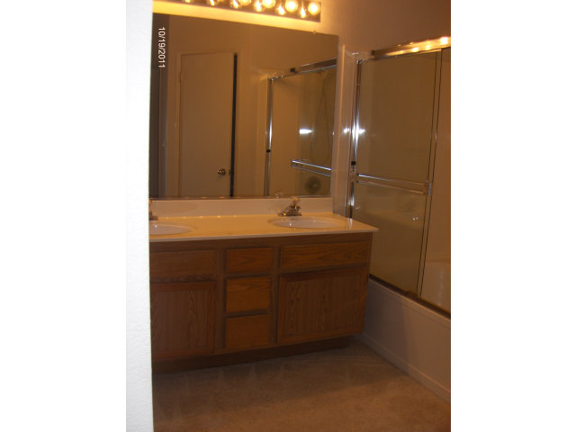 20 Torregata Loop San Jose, CA 95134 - Photo 9 of 12 a bathroom with a sink and a mirror