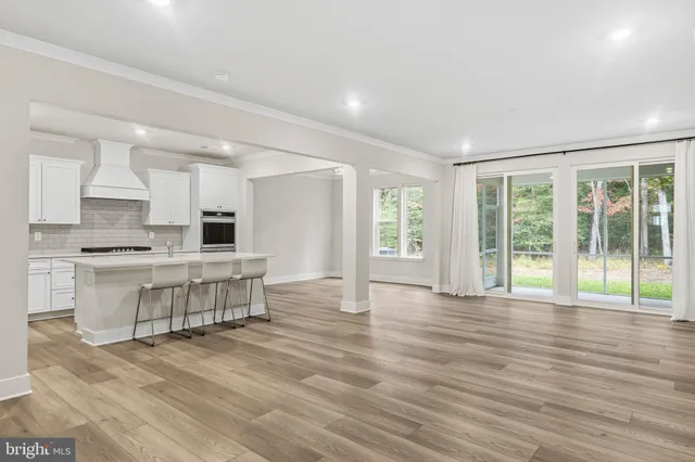 a view of kitchen with granite countertop window and a sink