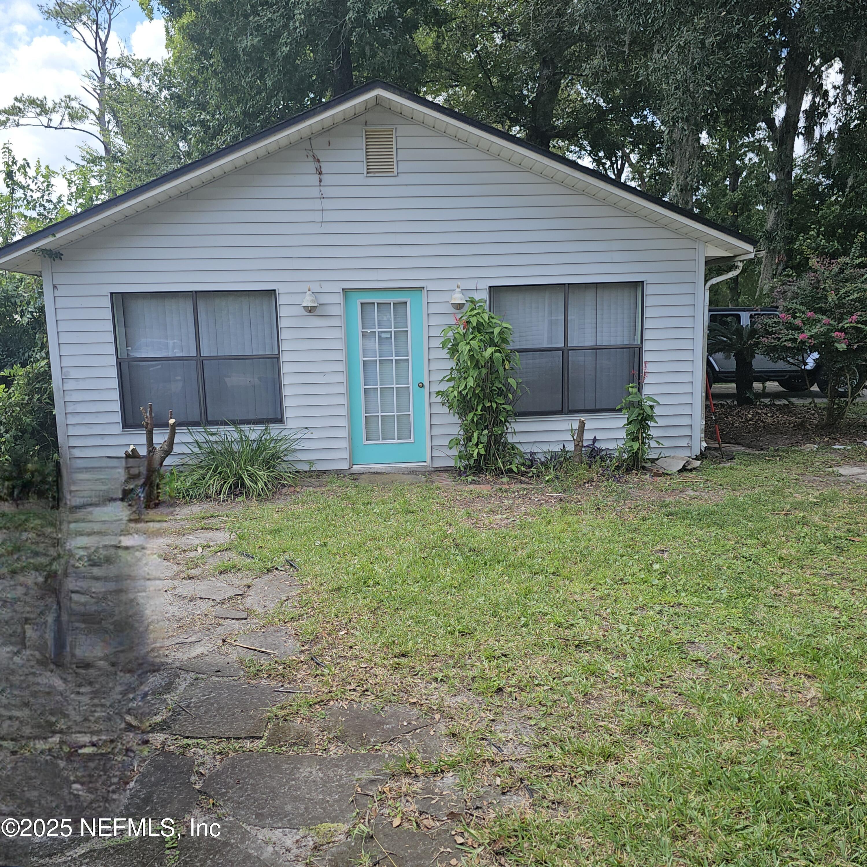 10596 Rutgers Road Jacksonville, FL 32218 - Photo 11 of 15 a front view of a house with garden