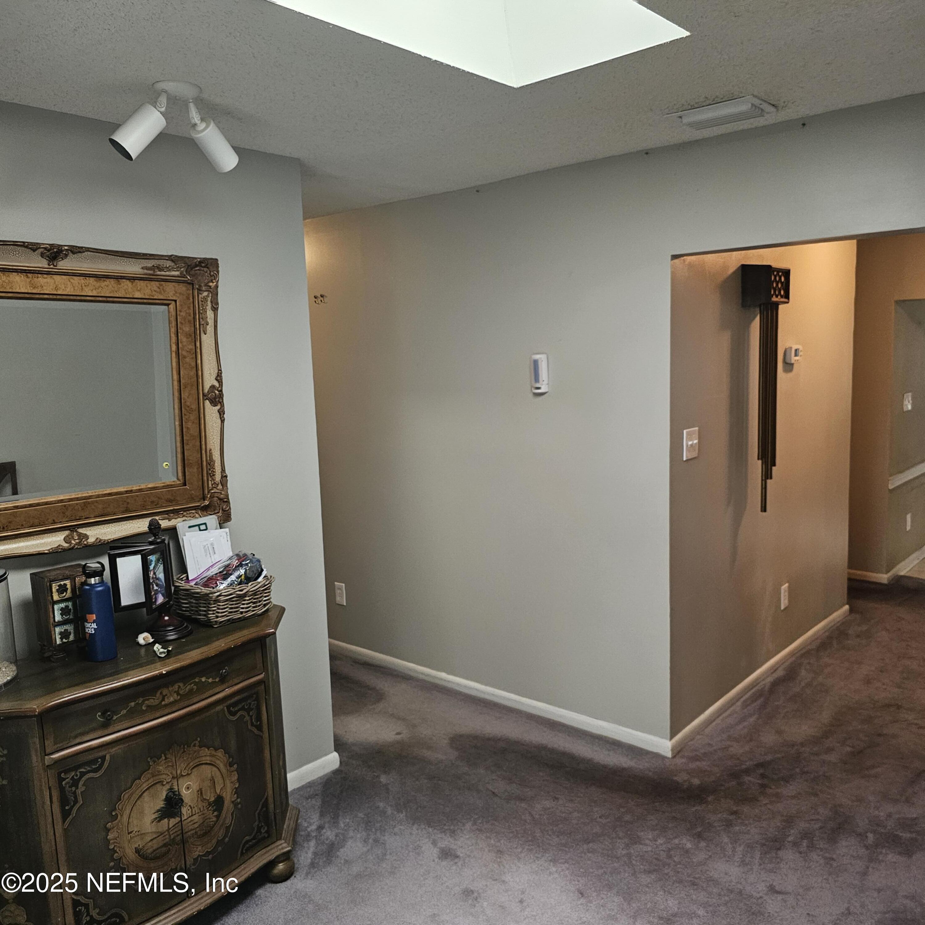 10596 Rutgers Road Jacksonville, FL 32218 - Photo 4 of 15 a room with stainless steel appliances white cabinets and a stove