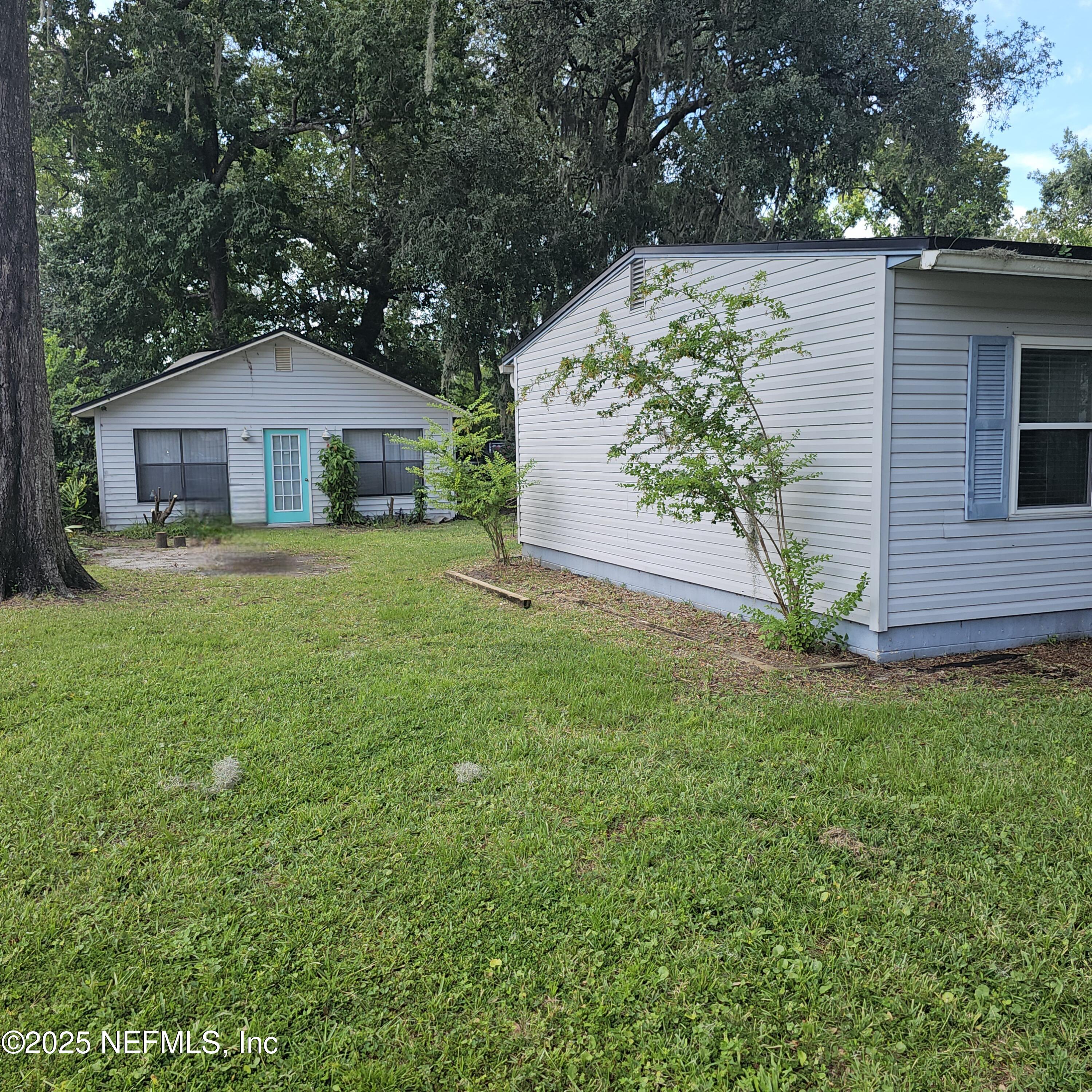 10596 Rutgers Road Jacksonville, FL 32218 - Photo 10 of 15 a front view of a house with a garden