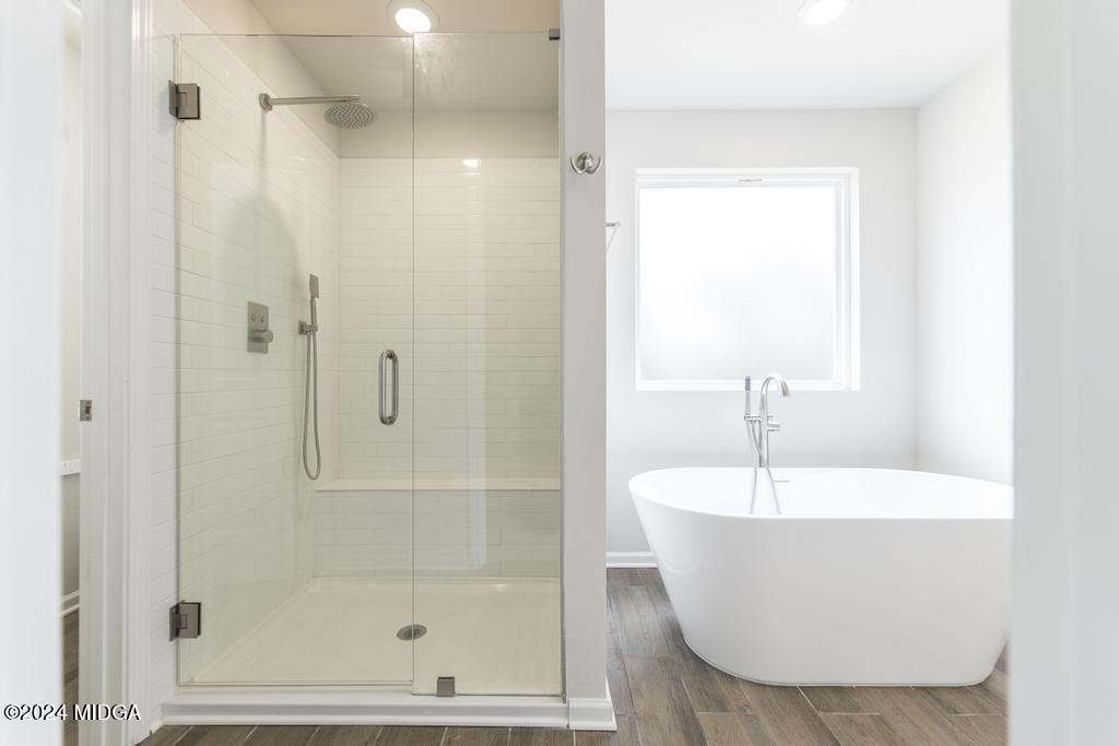 108 Cornfield Circle Perry, GA 31069 - Photo 23 of 39 a white bath tub sitting next to a shower