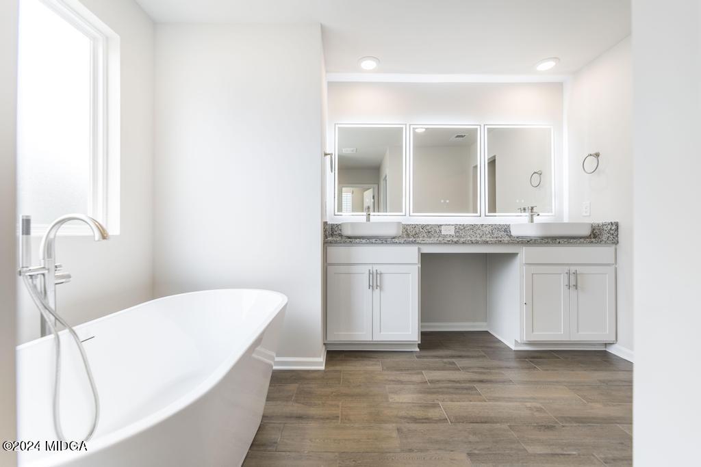 108 Cornfield Circle Perry, GA 31069 - Photo 24 of 39 a bathroom with a granite countertop sink and a mirror