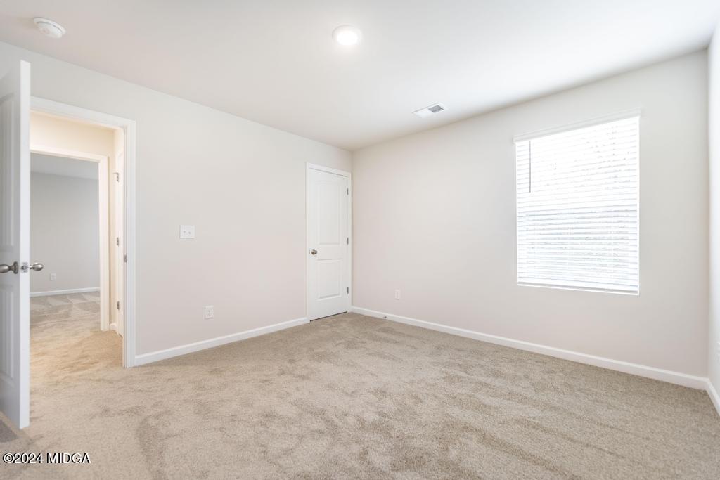 108 Cornfield Circle Perry, GA 31069 - Photo 28 of 39 an empty room with windows and closet