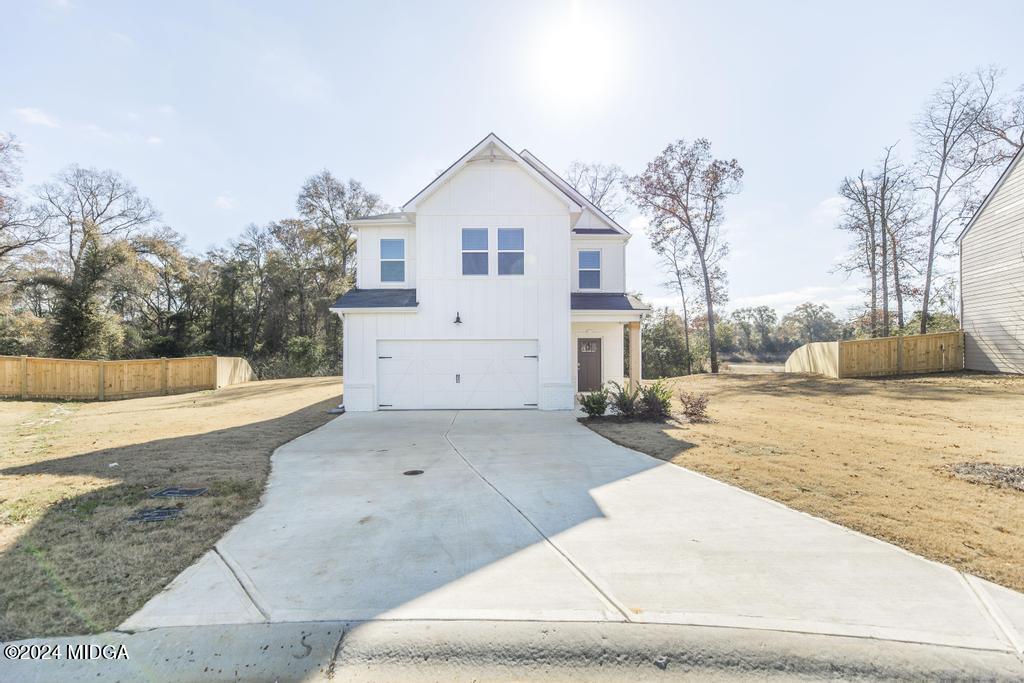 108 Cornfield Circle Perry, GA 31069 - Photo 3 of 39 a view of a white house with a yard