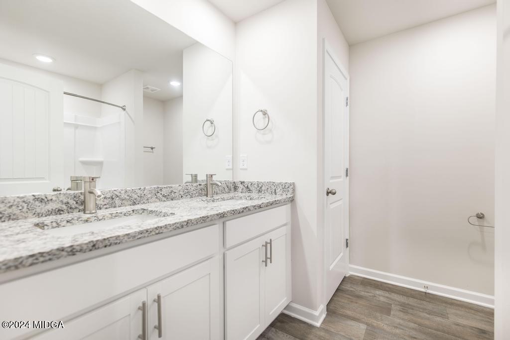 108 Cornfield Circle Perry, GA 31069 - Photo 31 of 39 a bathroom with a granite countertop sink and a mirror