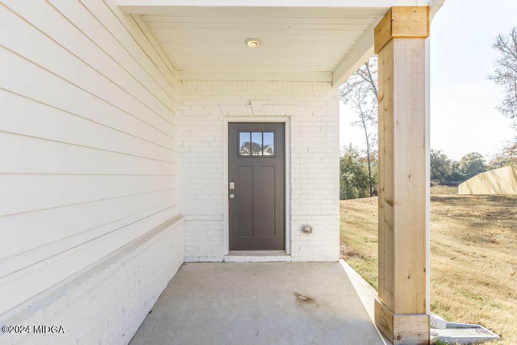 108 Cornfield Circle Perry, GA 31069 - Photo 6 of 39 a view of an empty room and window