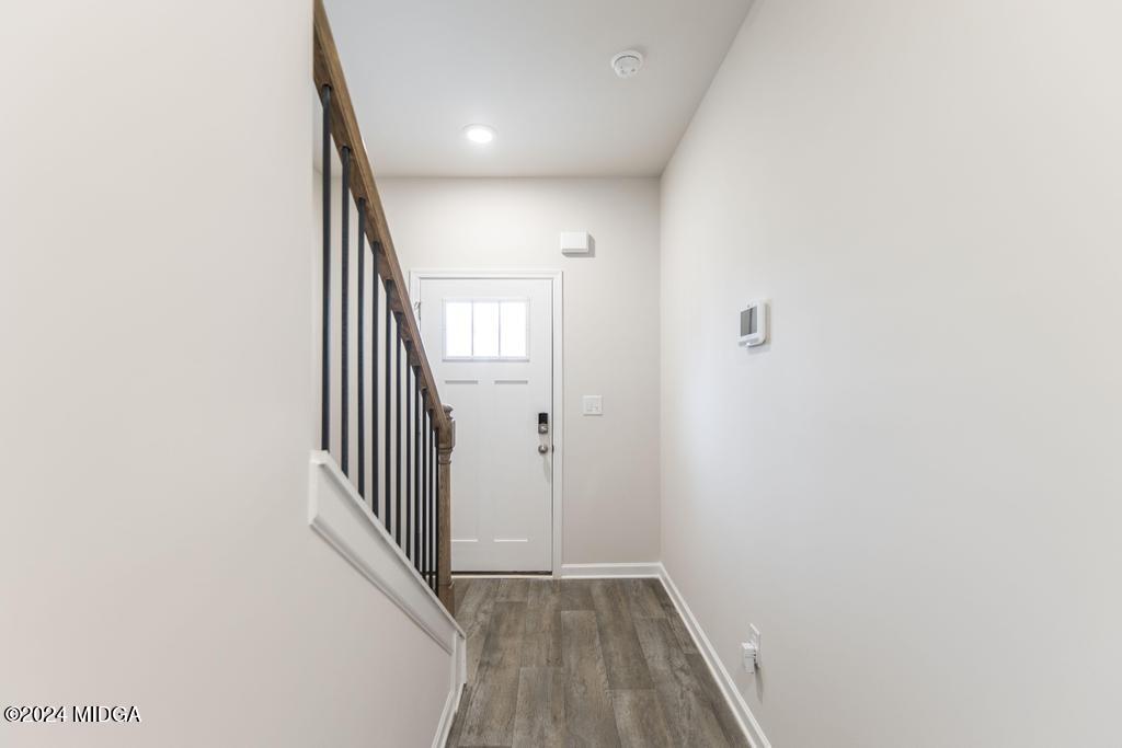 108 Cornfield Circle Perry, GA 31069 - Photo 7 of 39 a view of a hallway with wooden floor and entryway