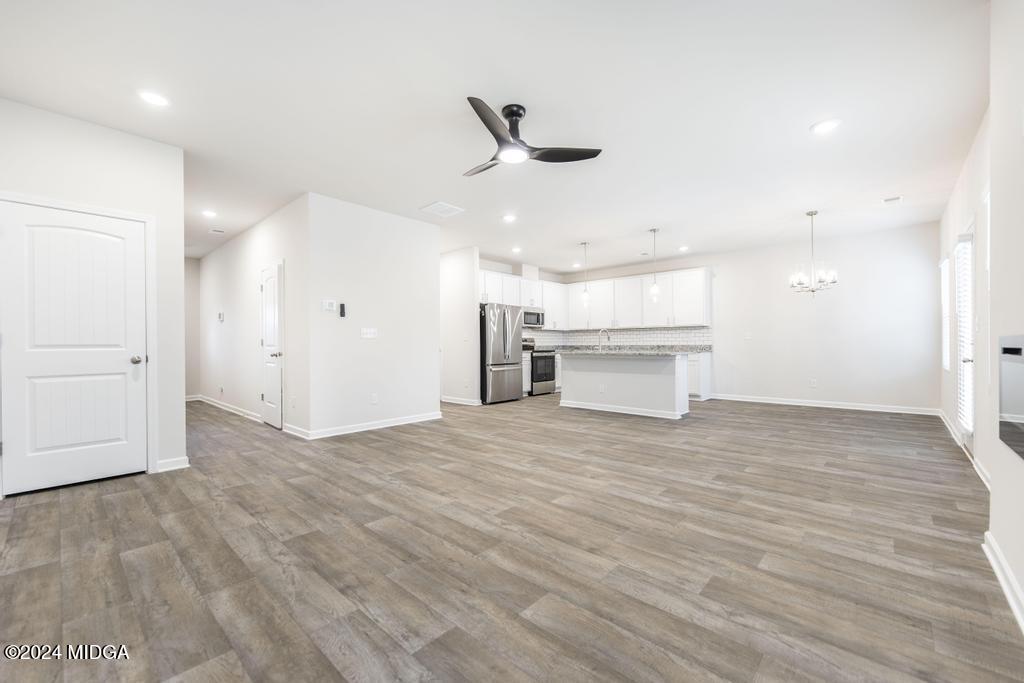 108 Cornfield Circle Perry, GA 31069 - Photo 9 of 39 a view of a kitchen with a sink and a refrigerator