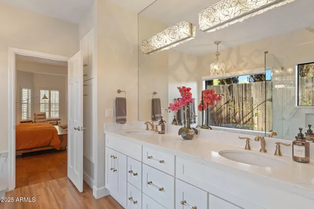 a spacious bedroom with a bed and a fireplace