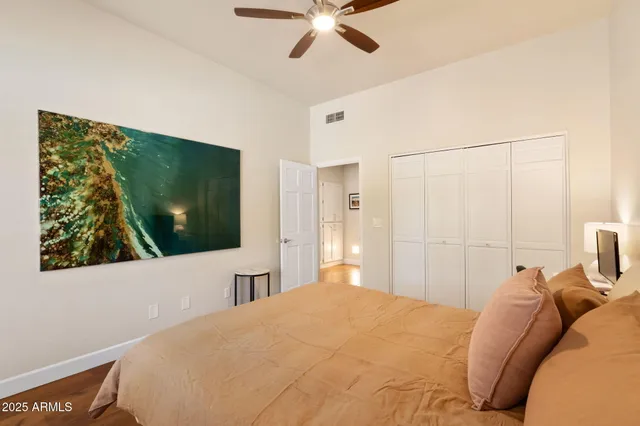 a bed room with a bed window and a chair