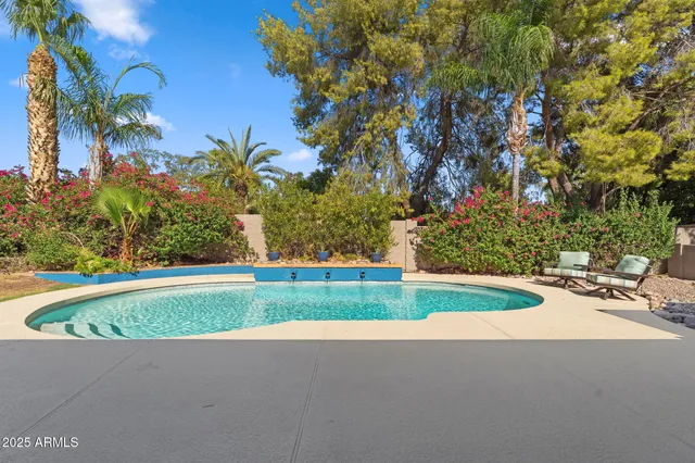a view of a swimming pool with a patio