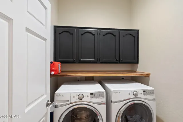 a dining room with furniture and a floor to ceiling window