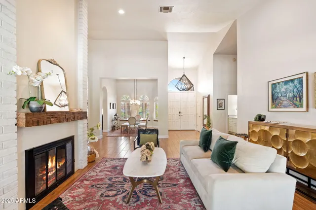 a living room with furniture and a fireplace