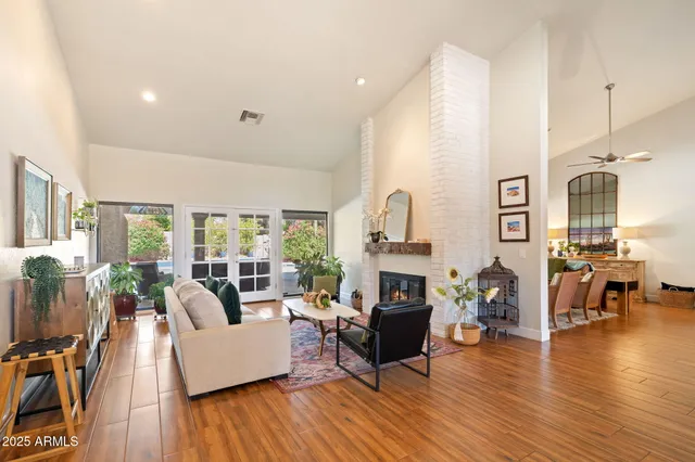 a living room with furniture fireplace and flat screen tv