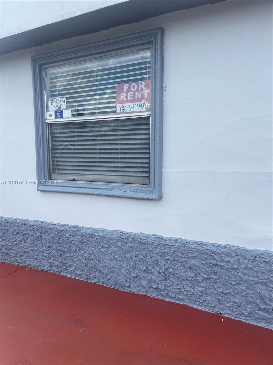 a view of a room that has a window