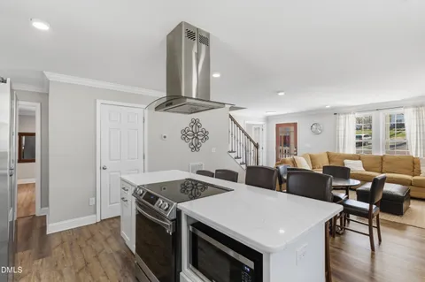 a kitchen with a table and chairs in it