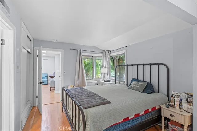 a bedroom with a bed and a dresser