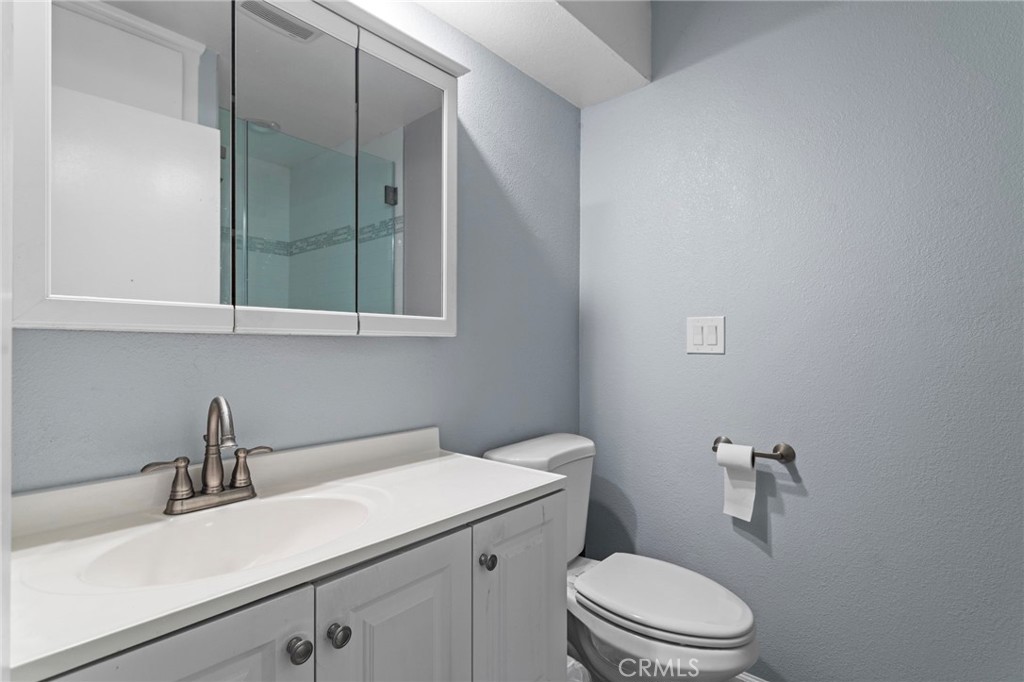 4065 Tenango Road Claremont, CA 91711 - Photo 14 of 30 a bathroom with a sink a toilet and vanity