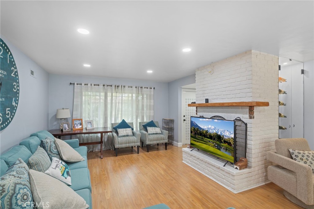 4065 Tenango Road Claremont, CA 91711 - Photo 15 of 30 a living room with furniture and a fireplace