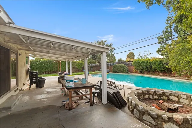 a view of a patio with a table and chairs