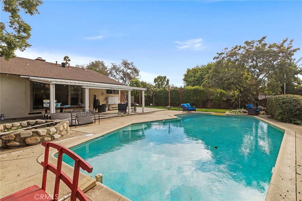 4065 Tenango Road Claremont, CA 91711 - Photo 24 of 30 a view of a house with swimming pool and sitting area