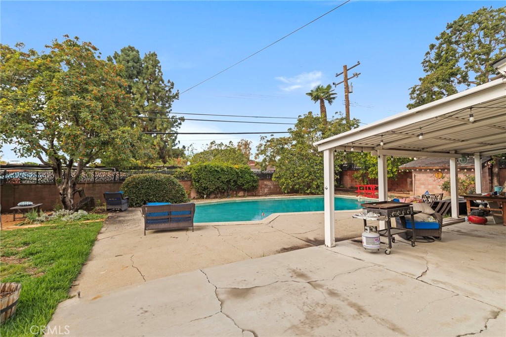 4065 Tenango Road Claremont, CA 91711 - Photo 30 of 30 a view of a patio with table and chairs potted plants with wooden fence
