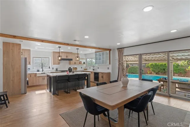 a kitchen with a table and chairs in it