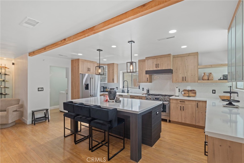 4065 Tenango Road Claremont, CA 91711 - Photo 9 of 30 a kitchen with appliances a sink a counter top space and cabinets