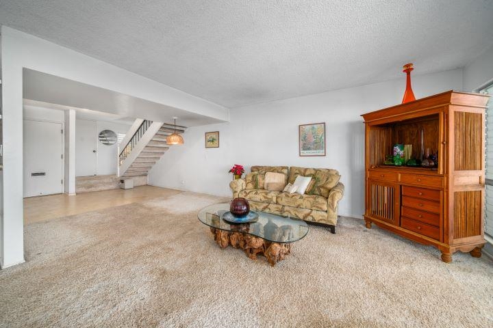 150 Puukolii Road, Unit 17 Lahaina, HI 96761 - Photo 11 of 40 a living room with furniture and a flat screen tv