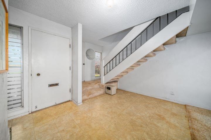 150 Puukolii Road, Unit 17 Lahaina, HI 96761 - Photo 22 of 40 a view of an empty room with stairs