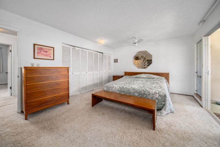150 Puukolii Road, Unit 17 Lahaina, HI 96761 - Photo 34 of 40 a bedroom with a bed and a cabinets
