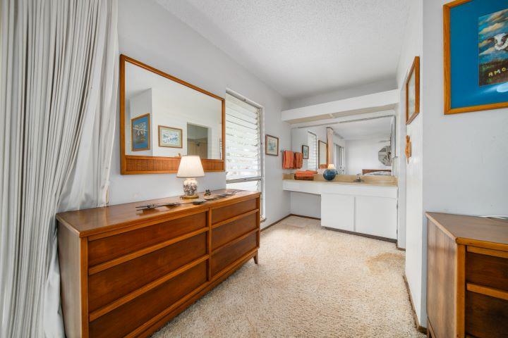 150 Puukolii Road, Unit 17 Lahaina, HI 96761 - Photo 35 of 40 a room with a bed and a cabinets