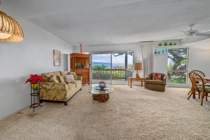 150 Puukolii Road, Unit 17 Lahaina, HI 96761 - Photo 7 of 40 a living room with furniture and a large window