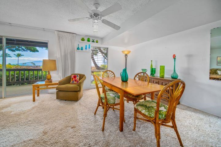 150 Puukolii Road, Unit 17 Lahaina, HI 96761 - Photo 9 of 40 a dining room with furniture and wooden floor