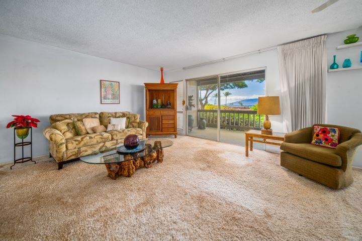150 Puukolii Road, Unit 17 Lahaina, HI 96761 - Photo 10 of 40 a living room with furniture and a large window