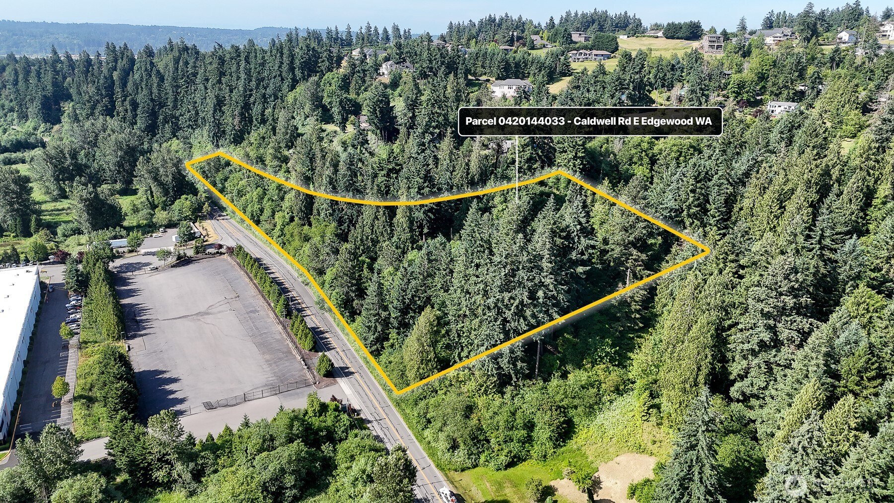 0 Caldwell Road East Puyallup, WA 98372 - Photo 2 of 13 a view of a house with a park