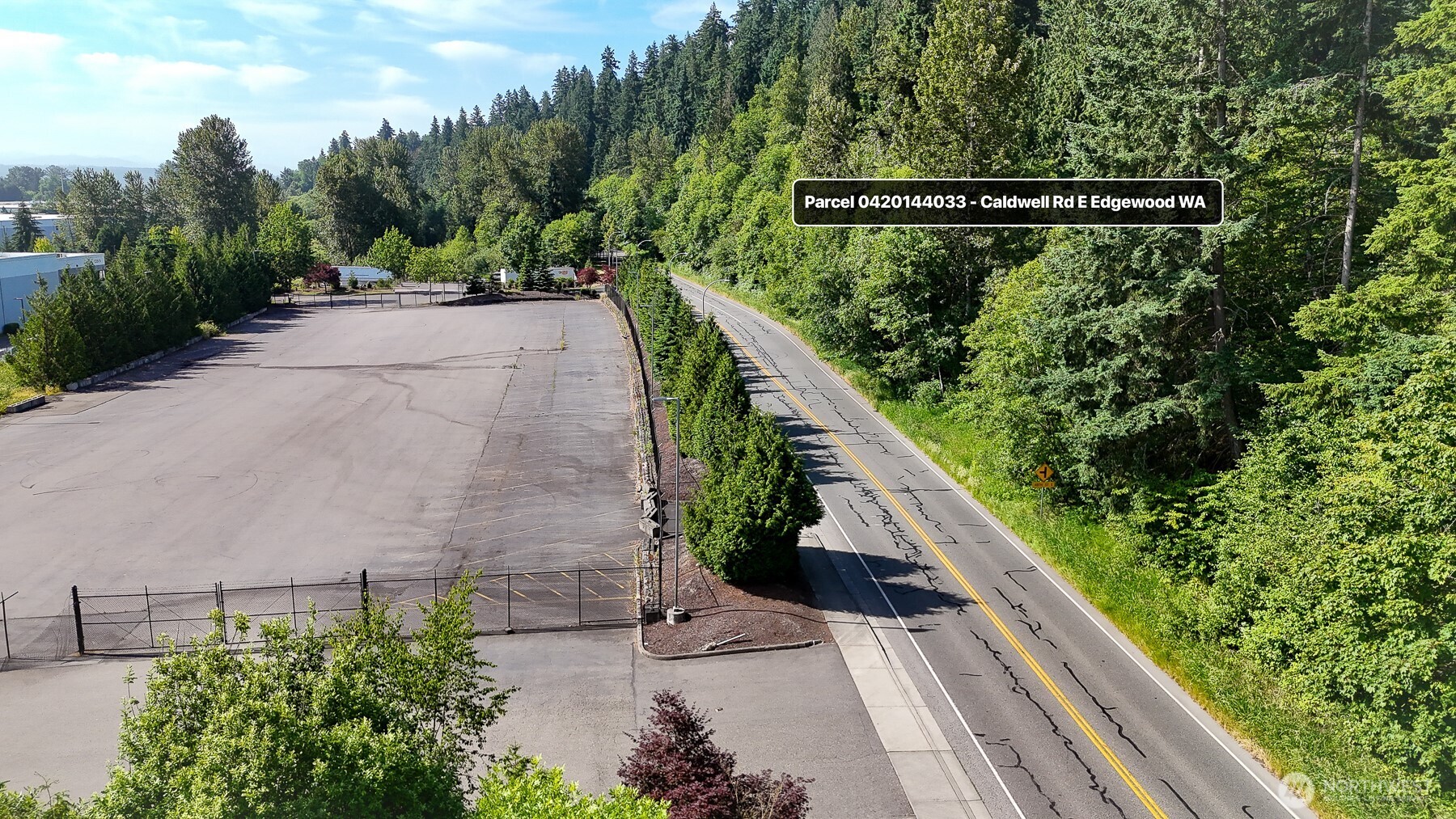 0 Caldwell Road East Puyallup, WA 98372 - Photo 4 of 13 a view of balcony with floor to ceiling windows and wooden fence