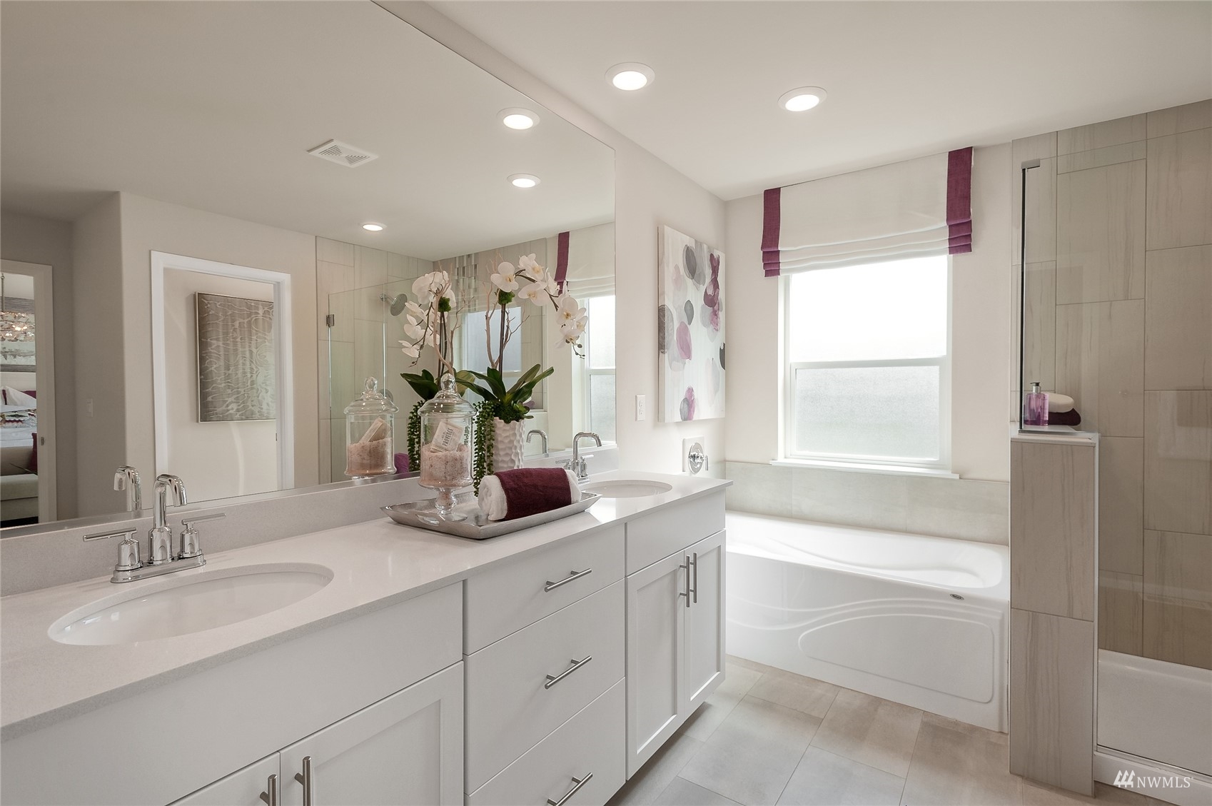 4018 233rd Street Southeast, Unit 76 Bothell, WA 98021 - Photo 16 of 18 a bathroom with a double vanity sink window and a bathtub