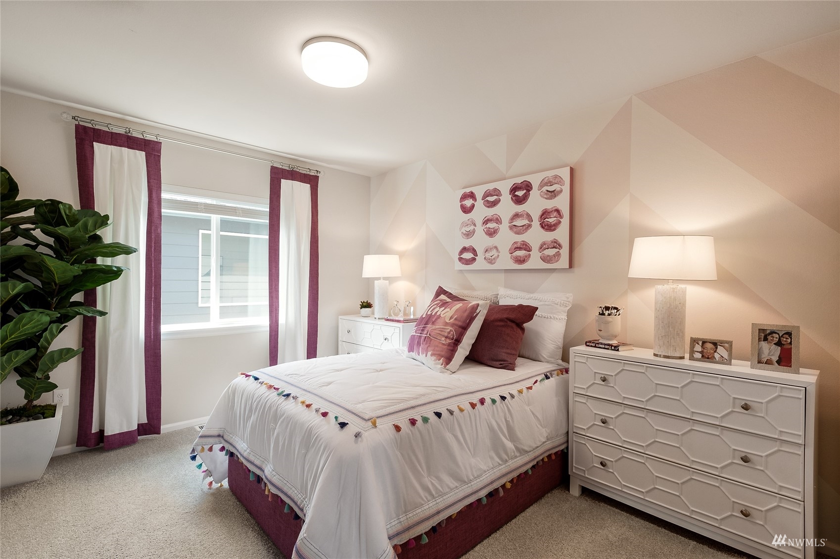 4018 233rd Street Southeast, Unit 76 Bothell, WA 98021 - Photo 7 of 18 a bedroom with a bed and a potted plant