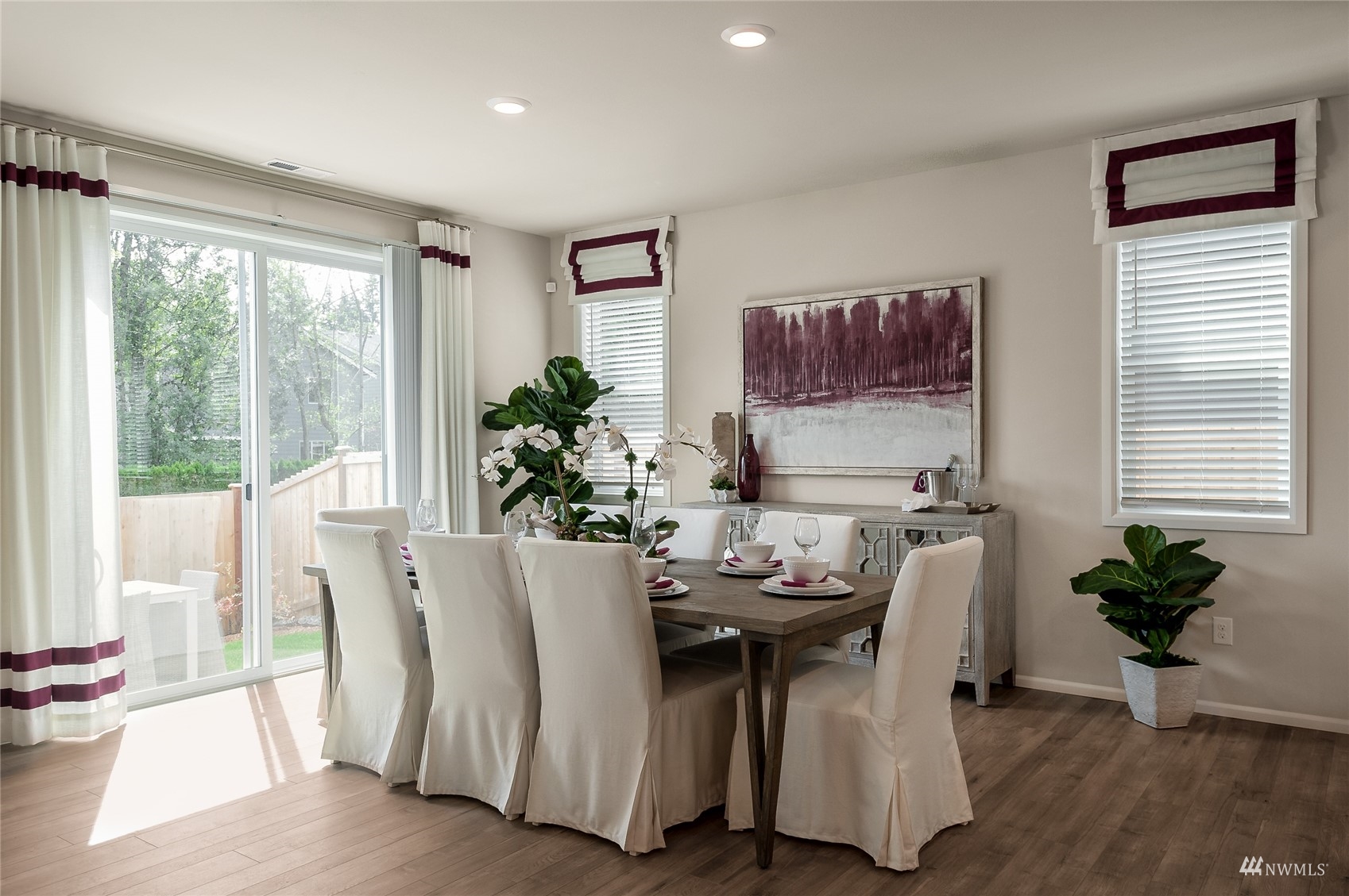 4018 233rd Street Southeast, Unit 76 Bothell, WA 98021 - Photo 9 of 18 a dining room with furniture and wooden floor