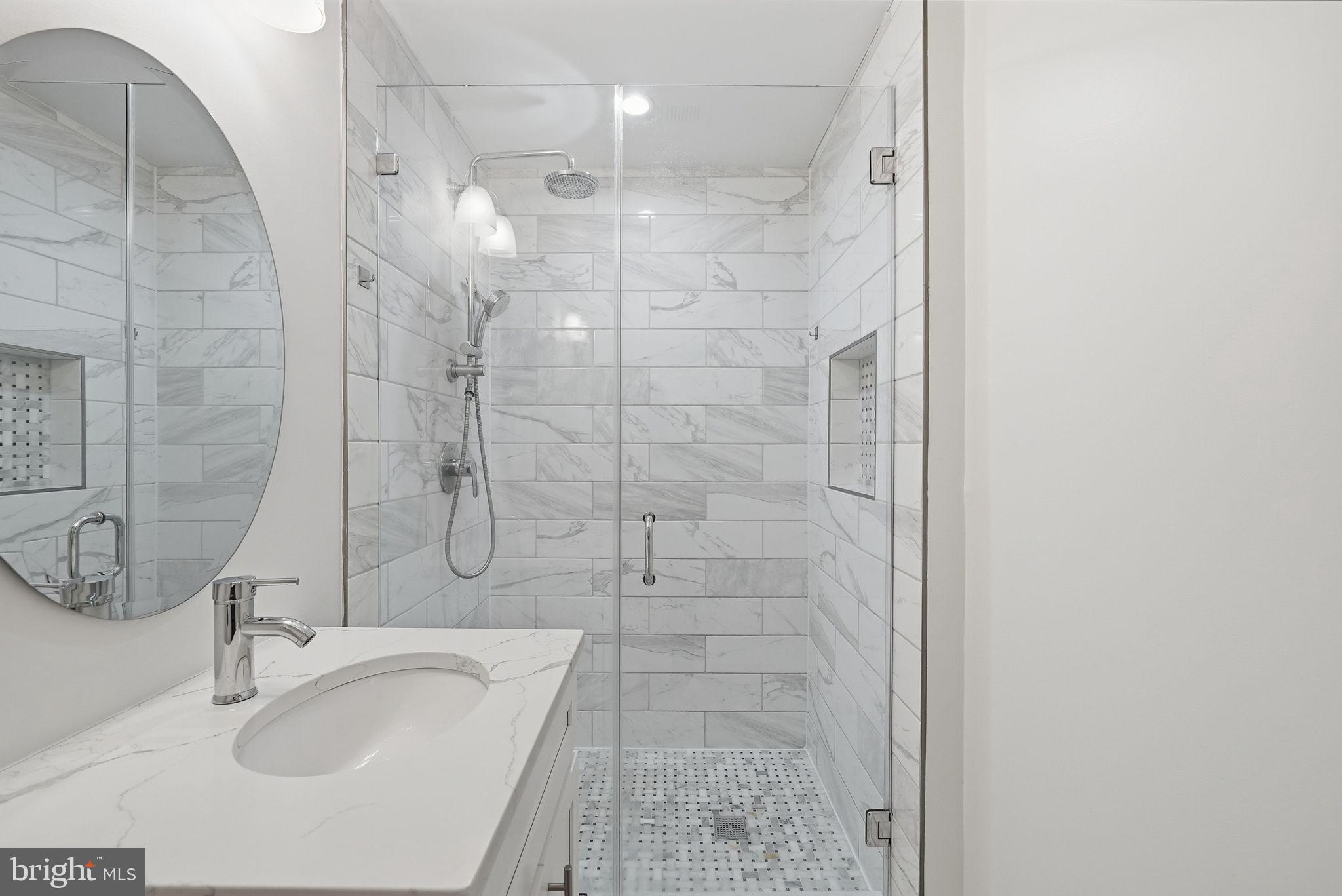 2121 4th Street Northeast, Unit 1 Washington, DC 20002 - Photo 21 of 34 Sleek modern shower with elegant tiles.